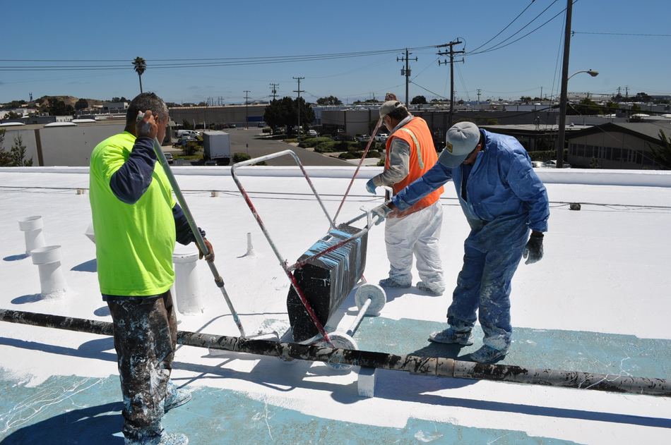 Commercial roof coating in progress by NuShake Roofing
