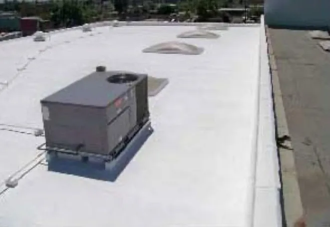 Commercial flat roof after a white coating restoration by NuShake Roofing
