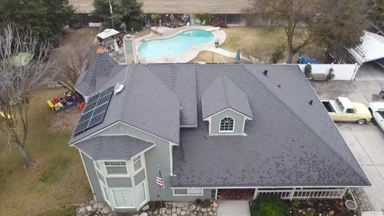 Roof replacement completed around a rooftop solar array by NuShake Roofing