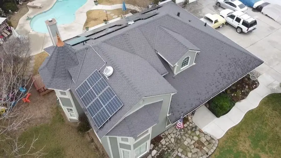 Roof replacement completed around a rooftop solar array by NuShake Roofing
