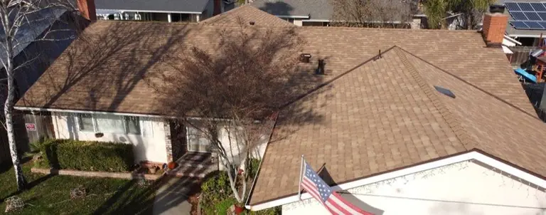 Completed architectural shingle roof by NuShake Roofing on a Central Valley home