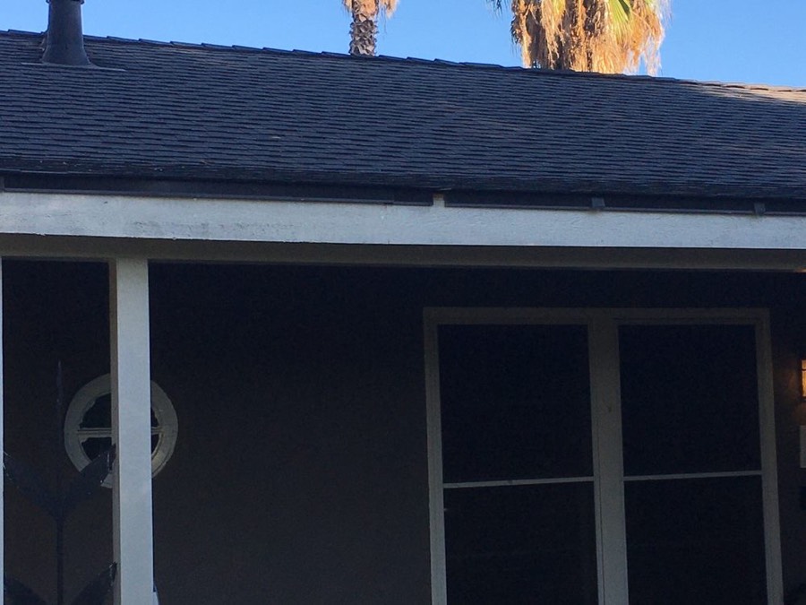 Eave, fascia, and flashing detail on a completed NuShake Roofing project